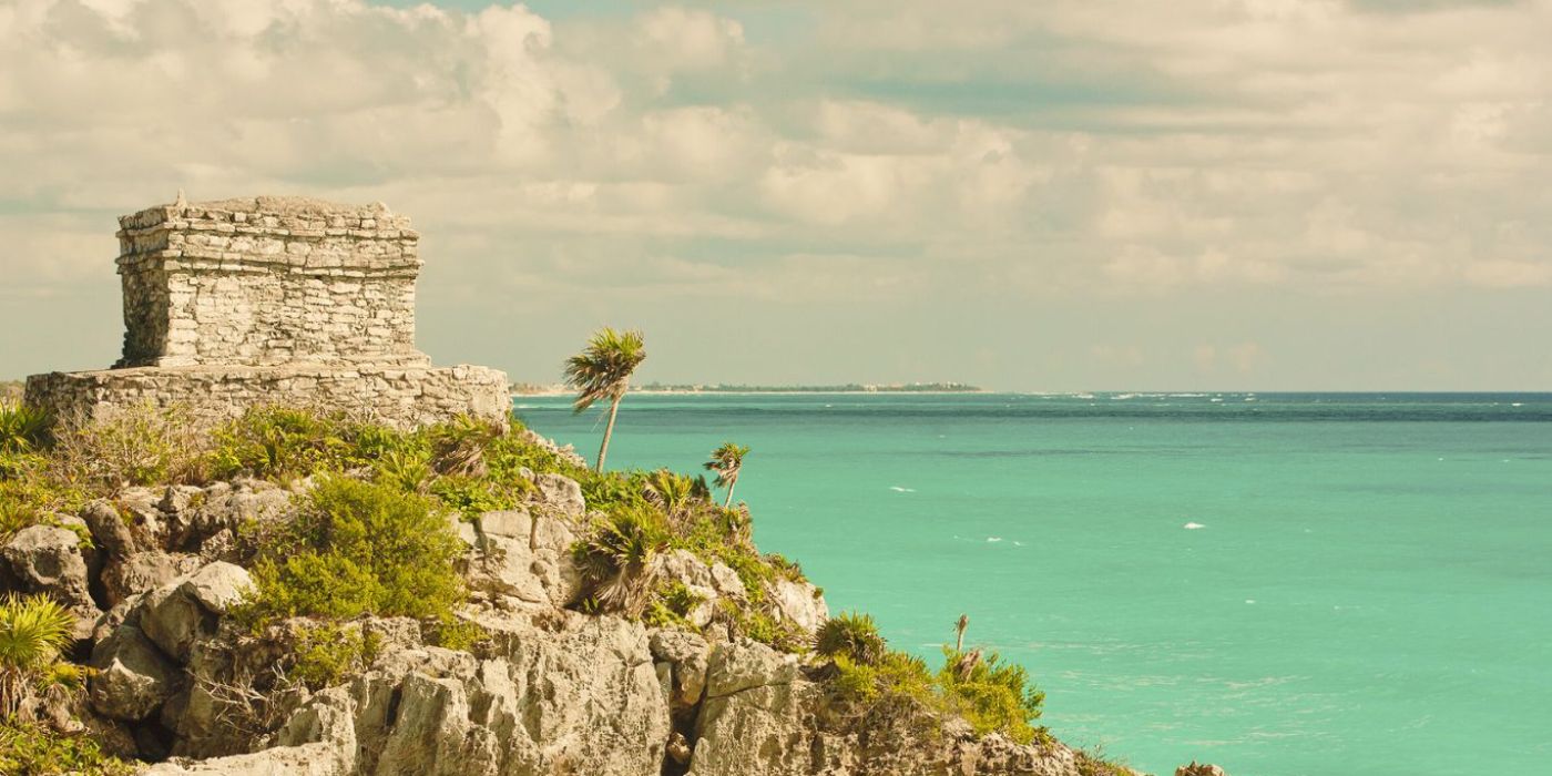 A view to Tulum's beach from behind mayan ruins.